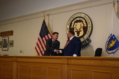 Chester Tam and Henry Bousquet shake hands at the end of the debate. Photos by Kat Sheridan