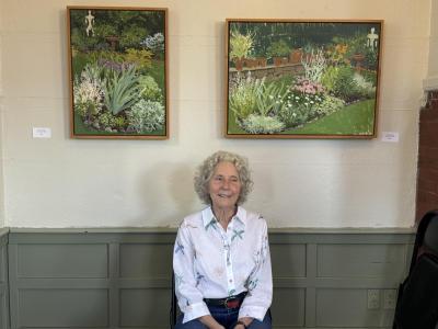 Pamela Hoss poses with a couple of her pieces. Photos by Kat Sheridan
