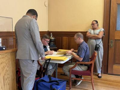Some of the workers performing the recount in New Bedford. 