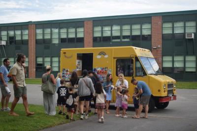 Kids line up for ice cream. 