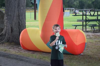 Dayton Lewis, age 6, enjoys a Shrek ice-cream bar. 