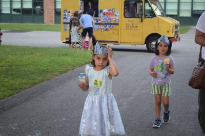 Claire and Ruby, both 5, enjoy some ice cream. 