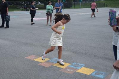 Ellie Sousa, 6, plays hop scotch. 