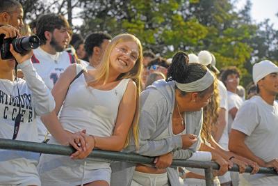 A student dressed in white. 
