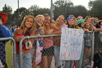 Dartmouth students with a sign for the Battle. 