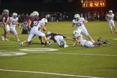 A Dartmouth player attempts to get the ball away from a Bishop Stang player. 