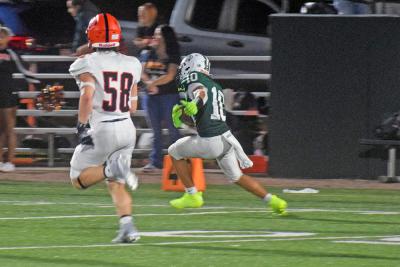 Chace Afonso runs with the ball. 