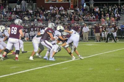 A Bishop Stang player gets tackled. 