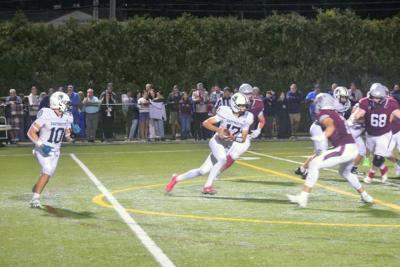 James Gilberg runs with the ball. 