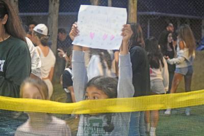 Naki Pachico cheers for her brother Dylan, who made the first touchdown. 