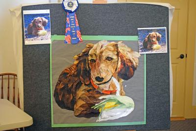 A quilt showing one of Nina's dachshunds. 