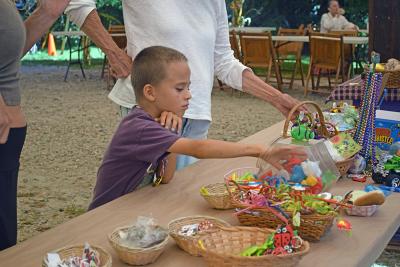 Samuel, 7, looks at the prizes. 