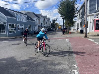 Riders turn onto Elm Street. 