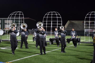 The wind section marches across the field. 