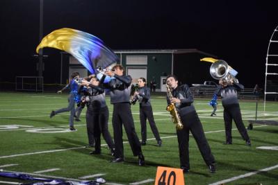 The performers lean in beat to the song. 