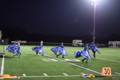 The color guard escapes from the cage. 
