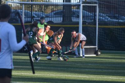 A Dartmouth and Barnstable player battle for the ball. 