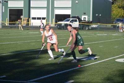A Dartmouth and Barnstable player race for the ball. 