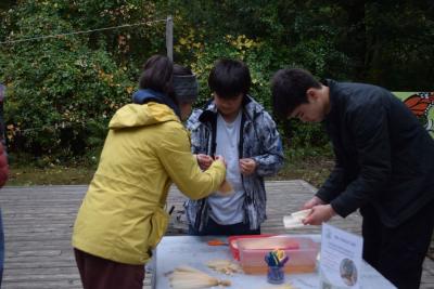 Kids learn how to make a corn husk doll. 