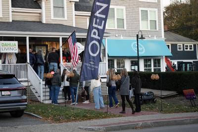 A crowd formed outside Padanaram Outfitters for a drink. 