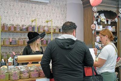Aubrey helps some customers while dressed up for the holiday. 