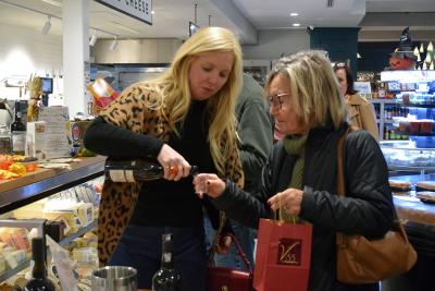 Judie and Hallee try wine paired with cheese. 