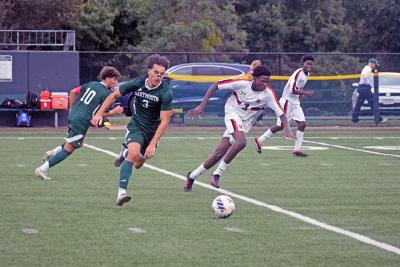 Logan Stott runs for the ball. 