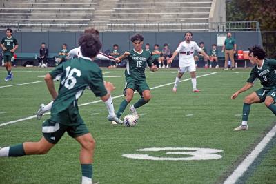 Kaleb Medeiros attempts to get the ball from an opposing player. 