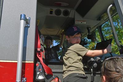 Two kids explore the fire truck. Photos by Kat Sheridan