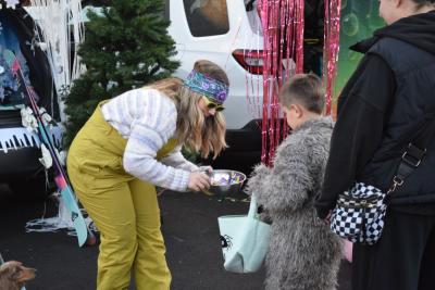 Jessica Dastous hands some candy to Sean (6) dressed as the big bad wolf. 