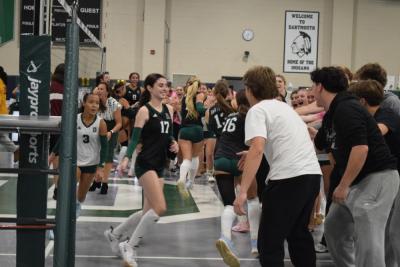 The students run past their friends for high fives. Photos by Kat Sheridan