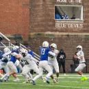 Jackson Hart ready to throw the ball during the Thanksgiving game against Fairhaven High School. Dartmouth won 21-16. Photo by Leighah Beausoleil