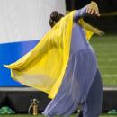 A member of the color guard dances. f