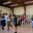 Kids practice the choreography. 