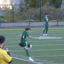 A teammate kicks the ball back into play. 