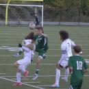 Logan Stott tries to keep the ball away from an opposing player. 