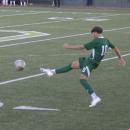 Caleb DaSilva kicks the ball. 