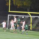 Landon Raposa jumps to headbutt the ball. 