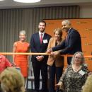 Governor Maura Healey and Manny Lopes cut the ribbon to open the PACE program in Dartmouth. 