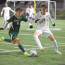 Mitchell Braydon goes after the ball. 