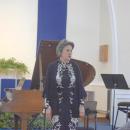 Janice Weber introduces the concert. 