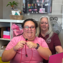 Paige and Marianne Santos pose while Paige works on a bracelet. Photos by Kat Sheridan