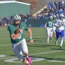 Aiden Gendron runs with the ball to attempt a touchdown. Photos by Kat Sheridan