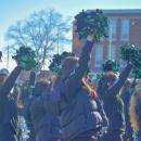 The cheerleaders get the crowd excited. 