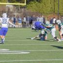 Brady Beauparland attempts to get the ball from a Fairhaven player, who jumps over him. 