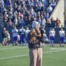 Emma Terach, a student at Dartmouth High School, sings the National Anthem. 