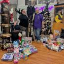 Co-owners Florrie Steele and Max Diamond pose with Krampus and the presents.