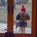 Miles McHenry, 6, looks into the building intrigued by the Kwanzaa celebration. 