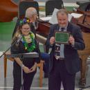 Hudson gives Kiely his plaque. 