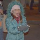 Aurea Wilson, 10, catches a bubble.